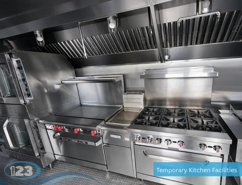 Commercial range, griddle, ventilation hood and ovens inside a mobile kitchen