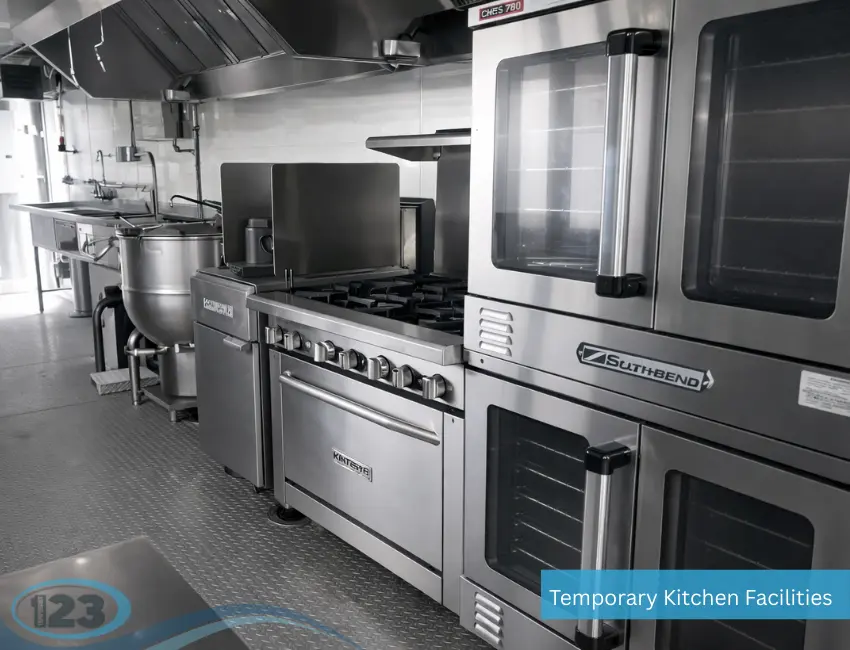 Commercial ovens, range and kettle line inside a mobile kitchen trailer